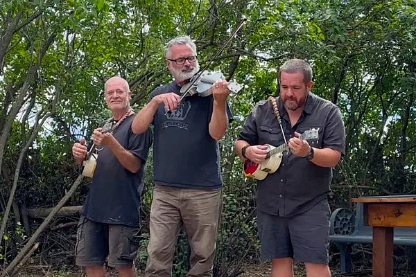 men playing ukeleles