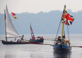 historic boats reenacting battle