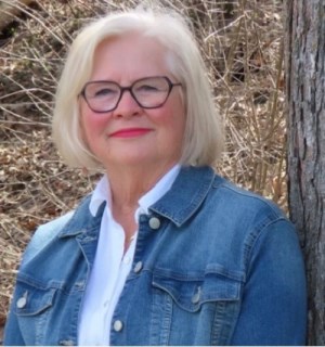 portrait of woman with white hair in denim jacket