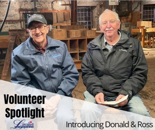 Two older gentlemen in factory setting with baskets