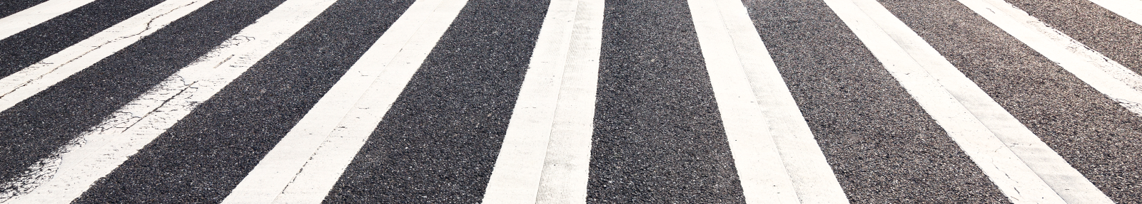 white stripes on road to signify pedestrian crossing
