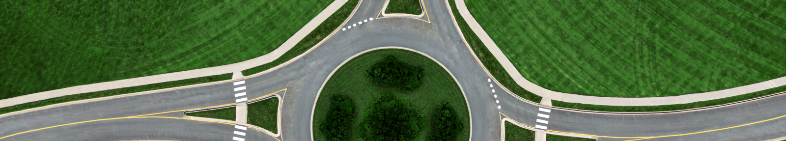 aerial photo of a roundabout in green countryside