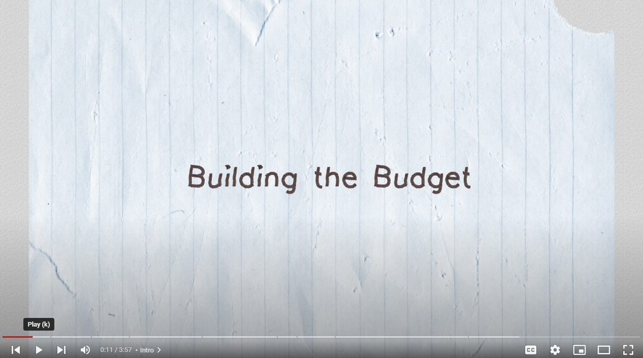 Screenshot of budget video with text reading Building the Budget